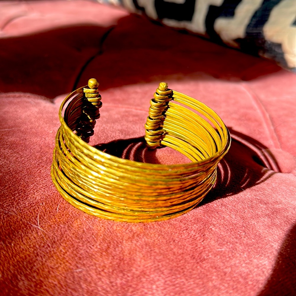 Stacked gold bangles